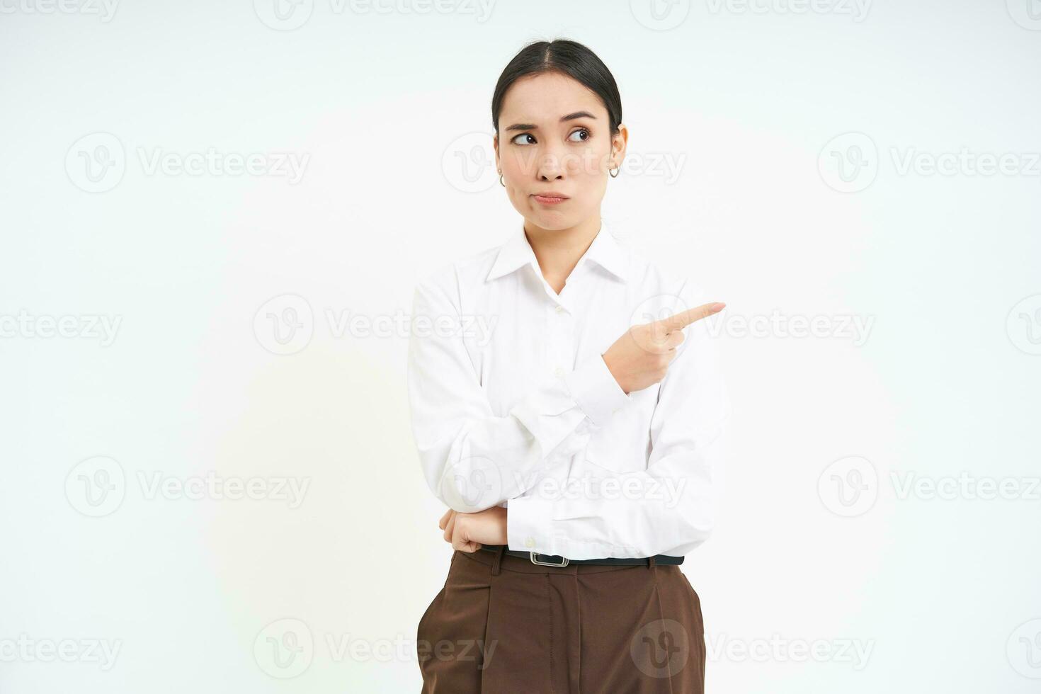 Image of female employee, office worker points finger at banner, shows promo advertisement on isolated white background photo