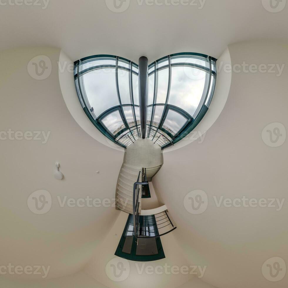 abstractly twisted into a spherical 360 panorama interior of a modern office with a hall staircase and panoramic windows photo