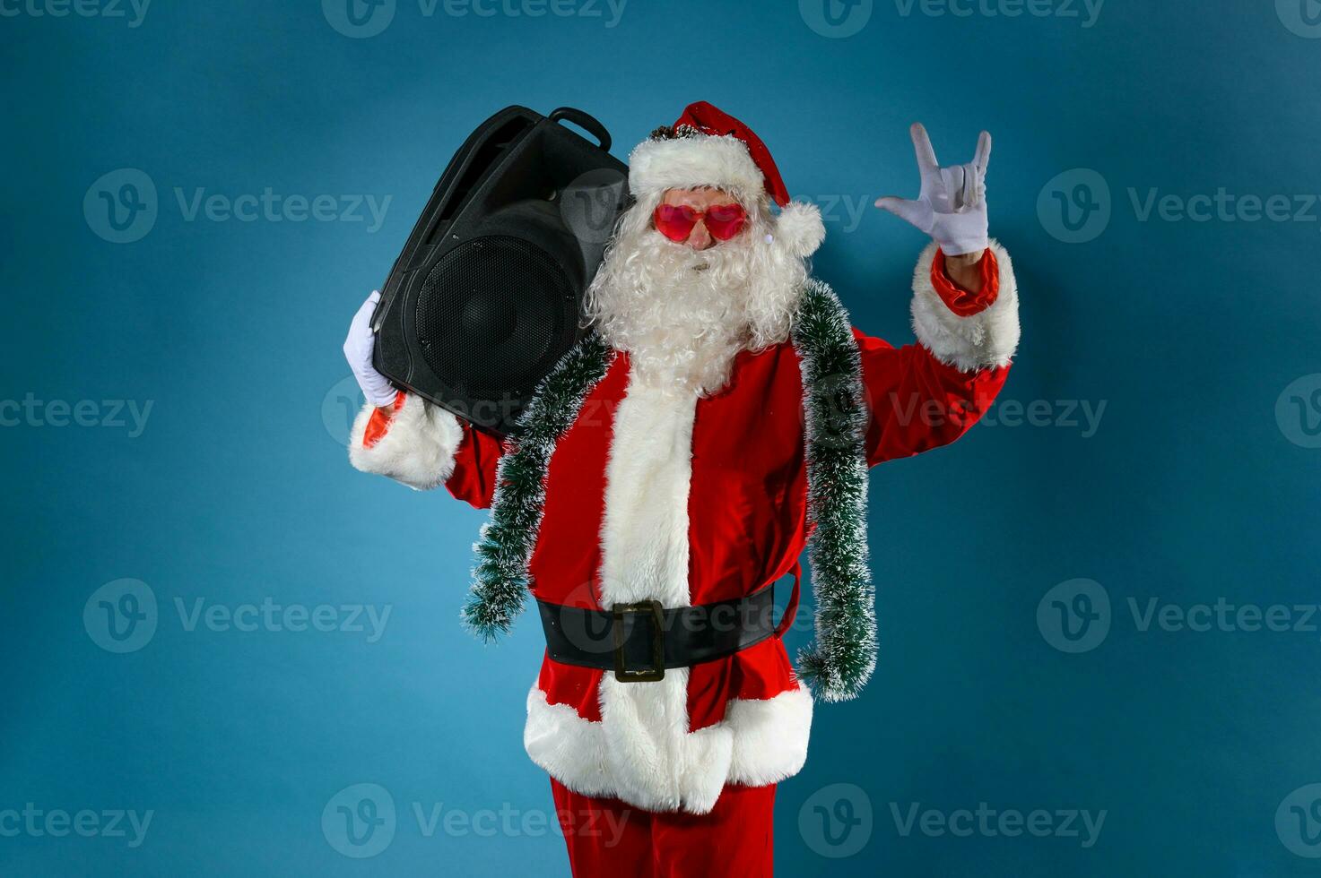 Santa claus with music box in hand photo