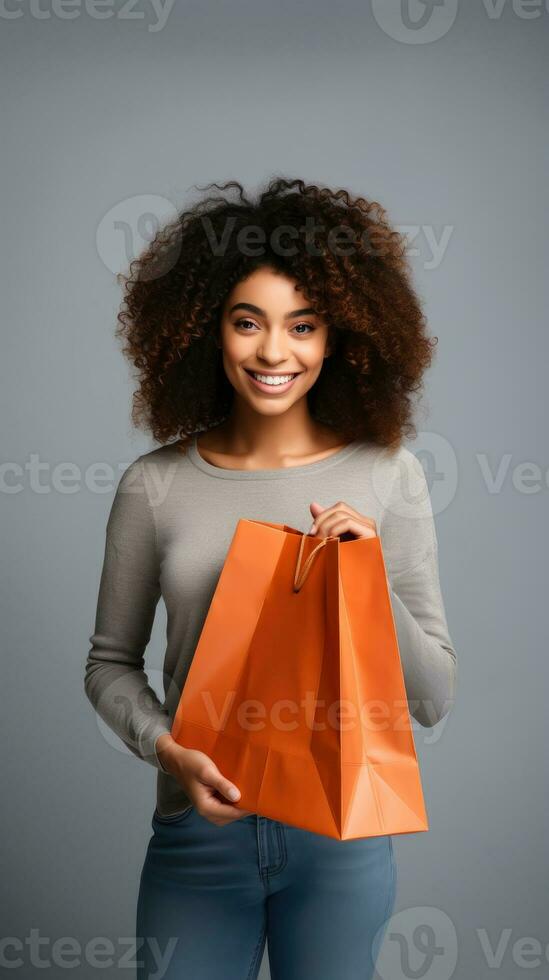 AI generated Portrait of african woman holding shopping bag in seasonal holidays sale isolated on grey background photo