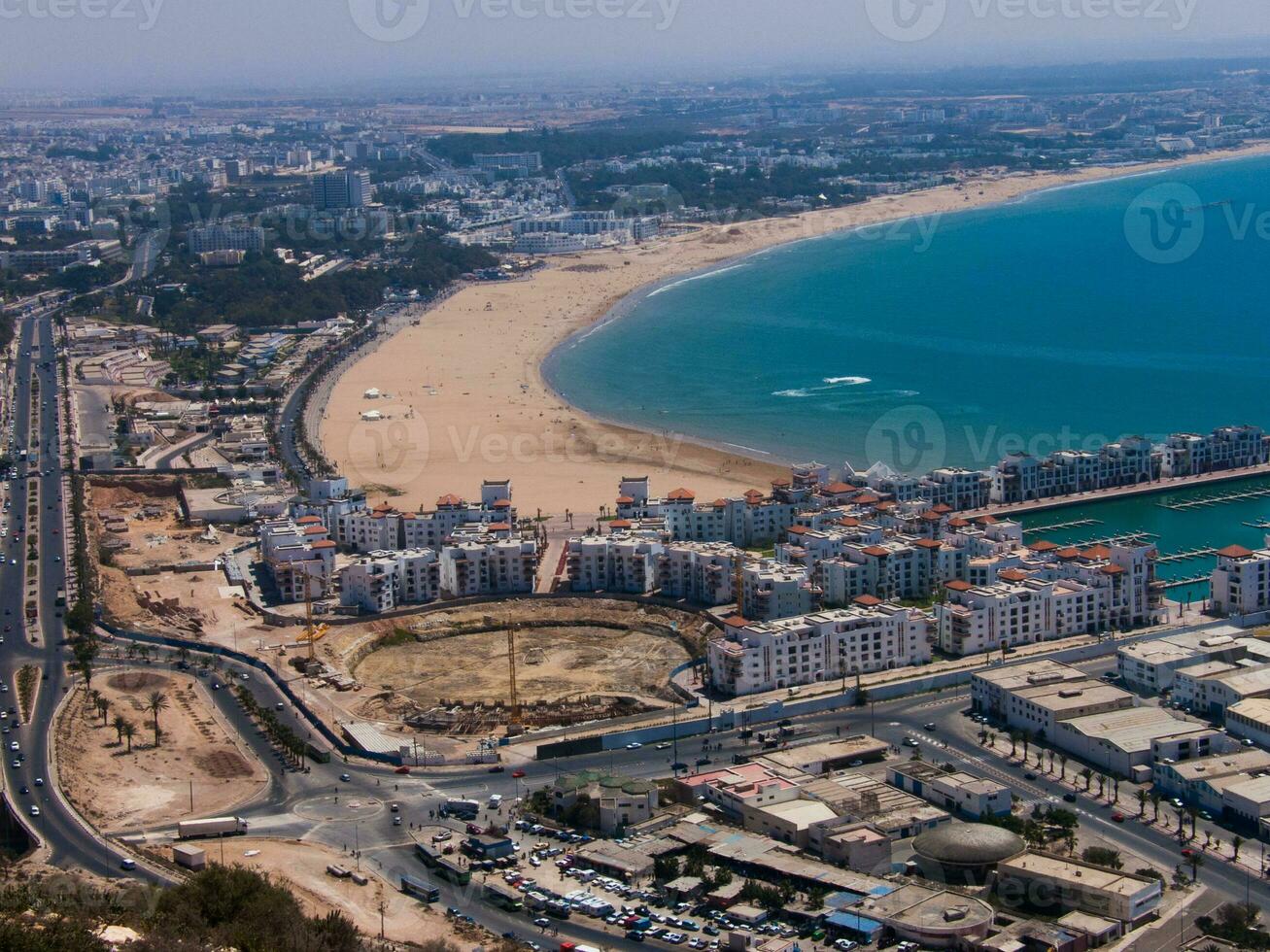 a view of a beach and city from above photo