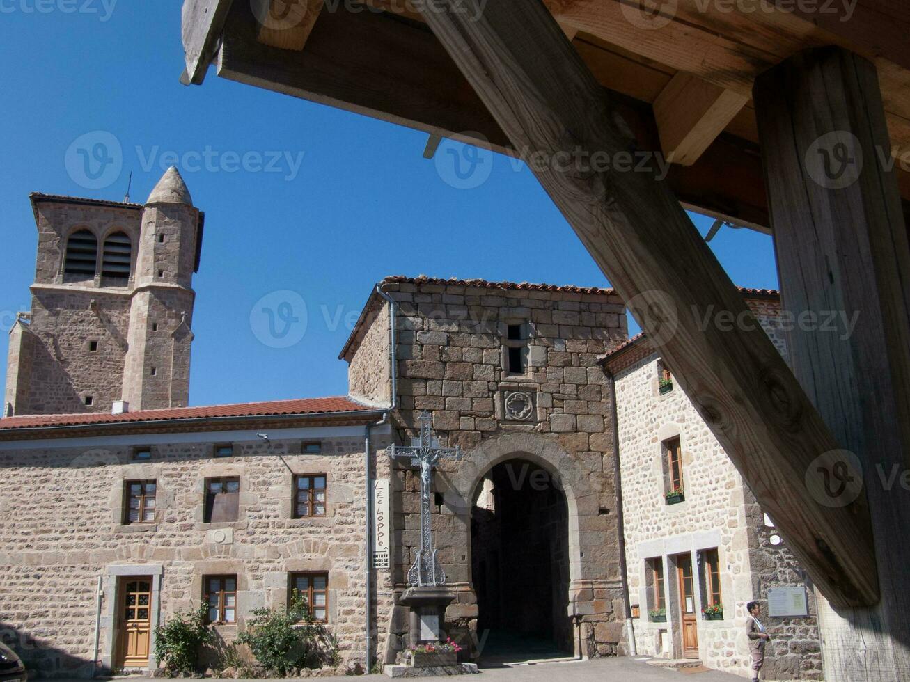 a wooden beam in the middle of the street photo