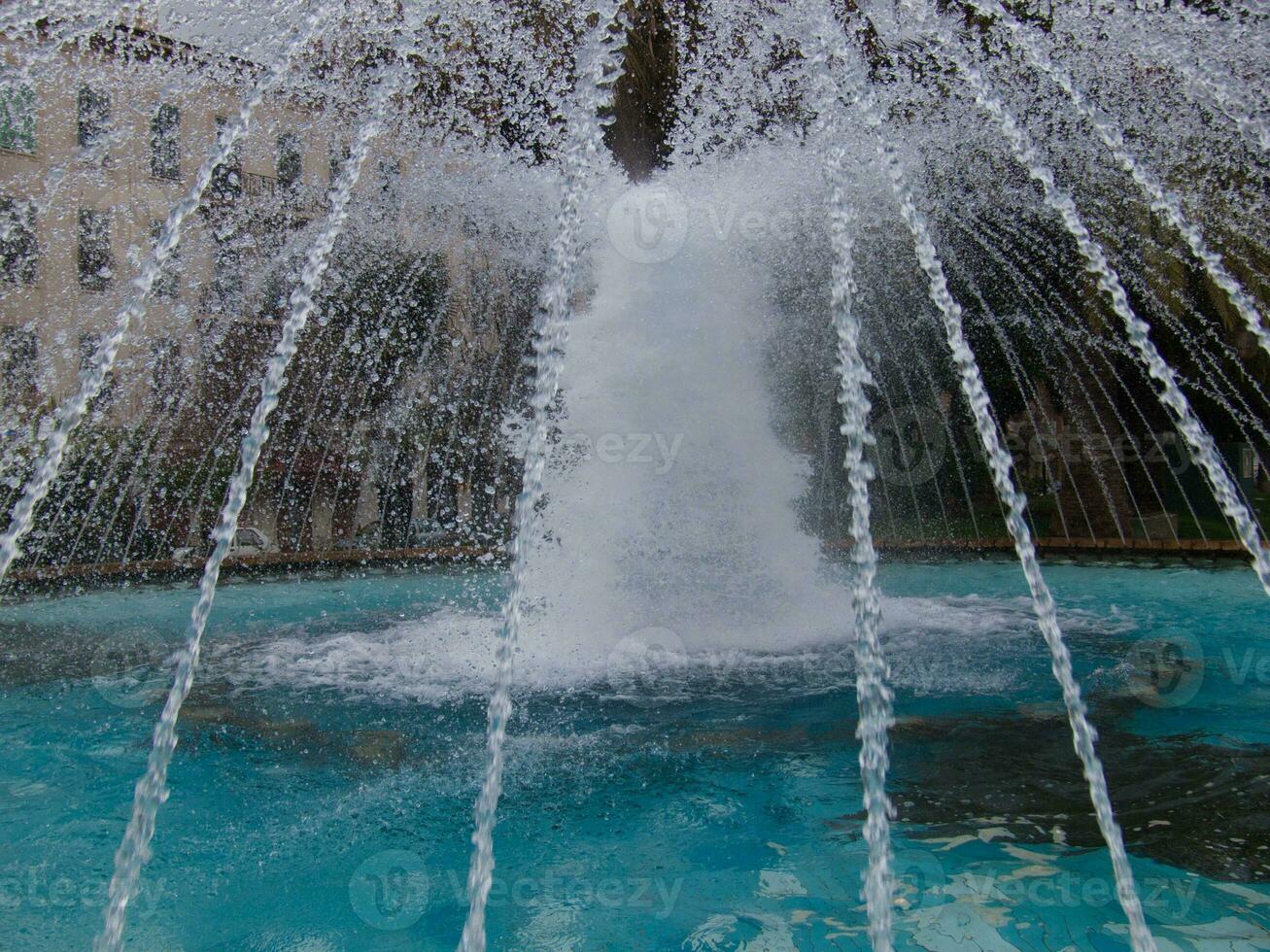 a fountain in a park photo