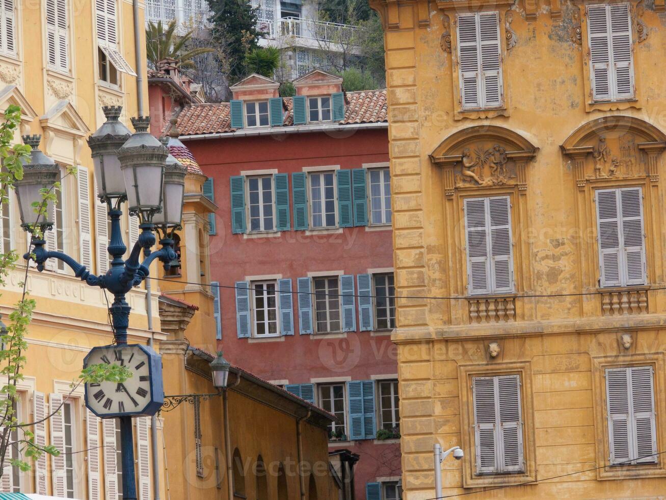 a tall building with a clock on it photo