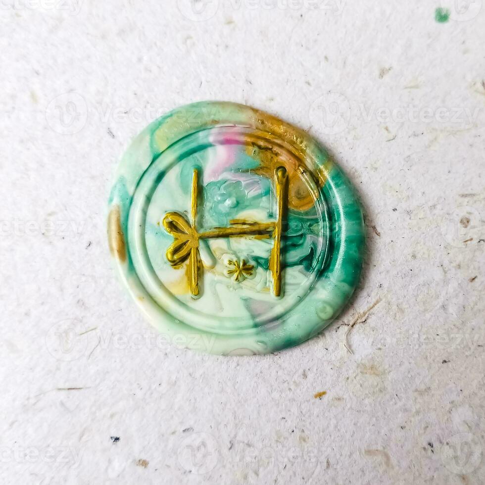 A macro shot of a colorful watercolor ornament on a white background. photo