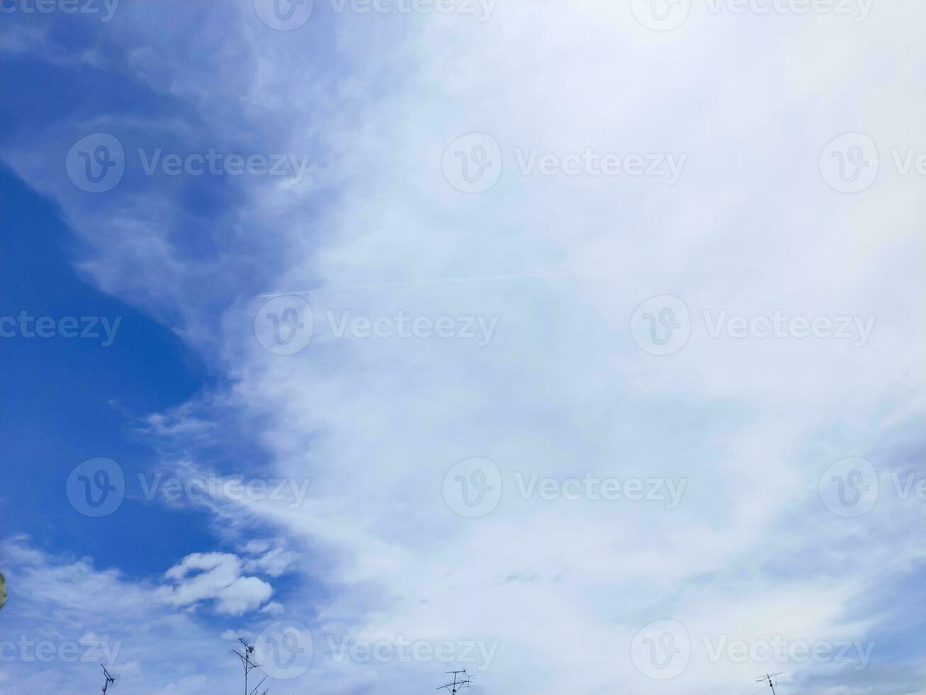 blue sky background with tiny cloudscape as background or wallpaper photo