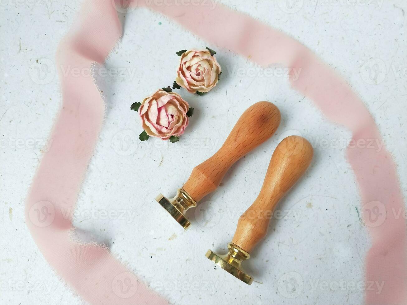 Colorful wax seal stamps and wax bead on a white background photo