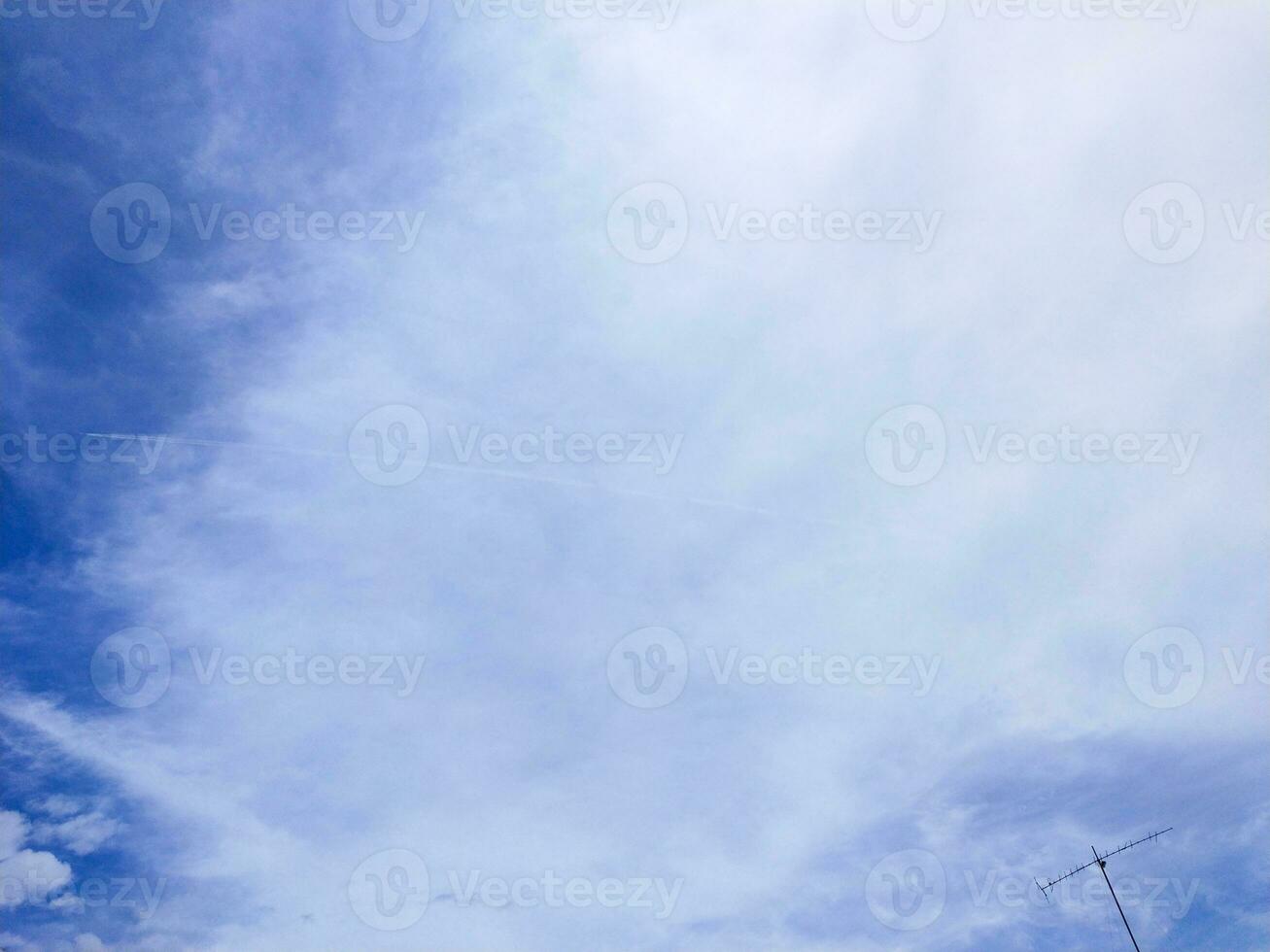 blue sky background with tiny cloudscape as background or wallpaper photo