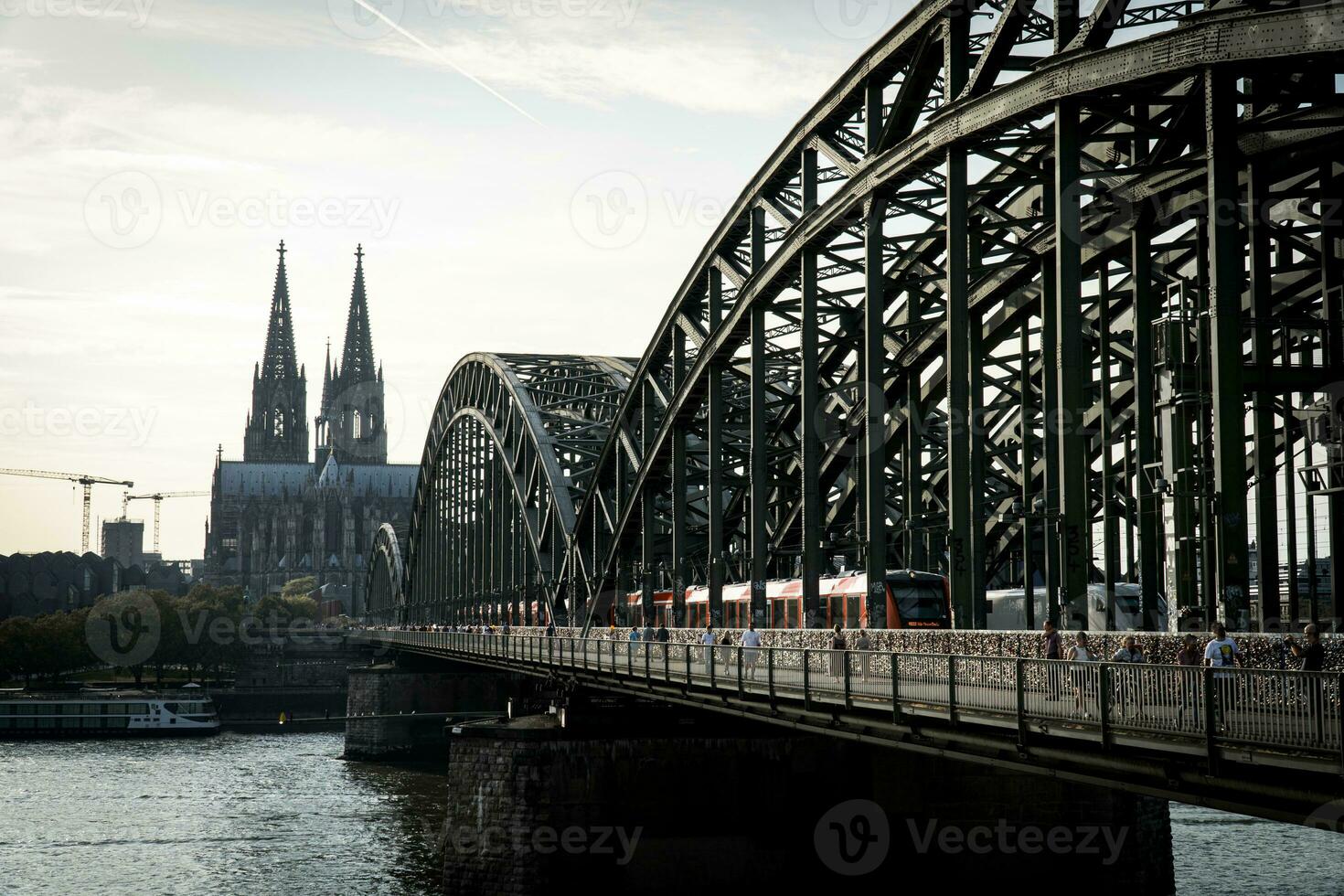 Hohenzollern Bridge and Cologne Cathedral in the evening photo