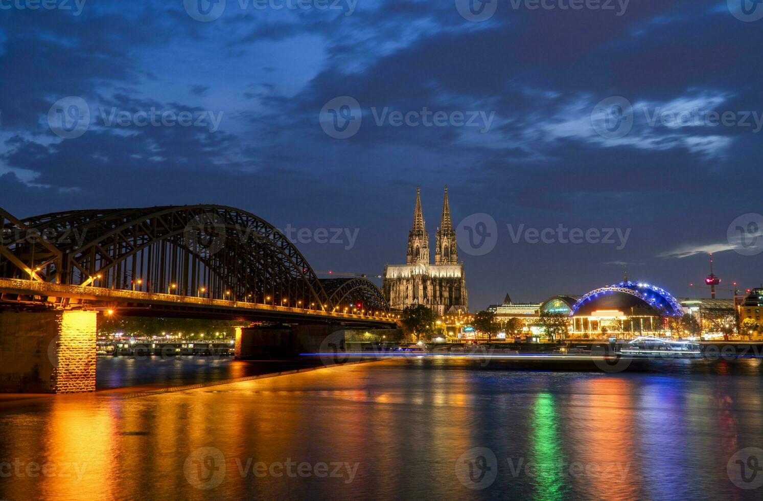 Cologne Cathedral and Hohenzollern Bridge in the evening photo