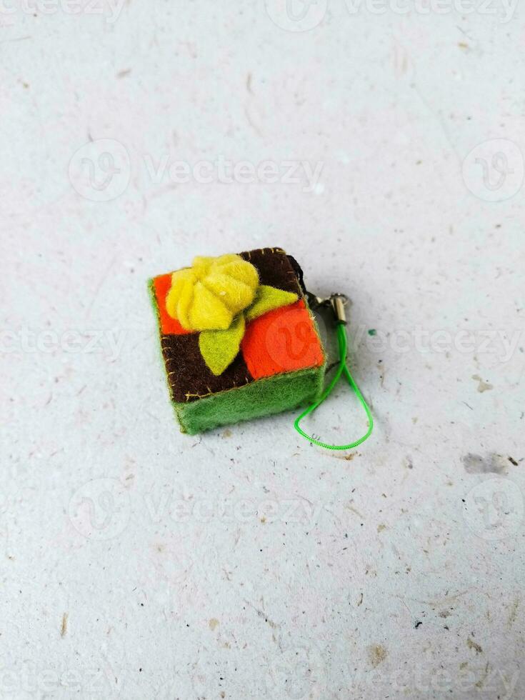 a closeup shot of handmade felt woolen toy on a white background. Selective focus. photo