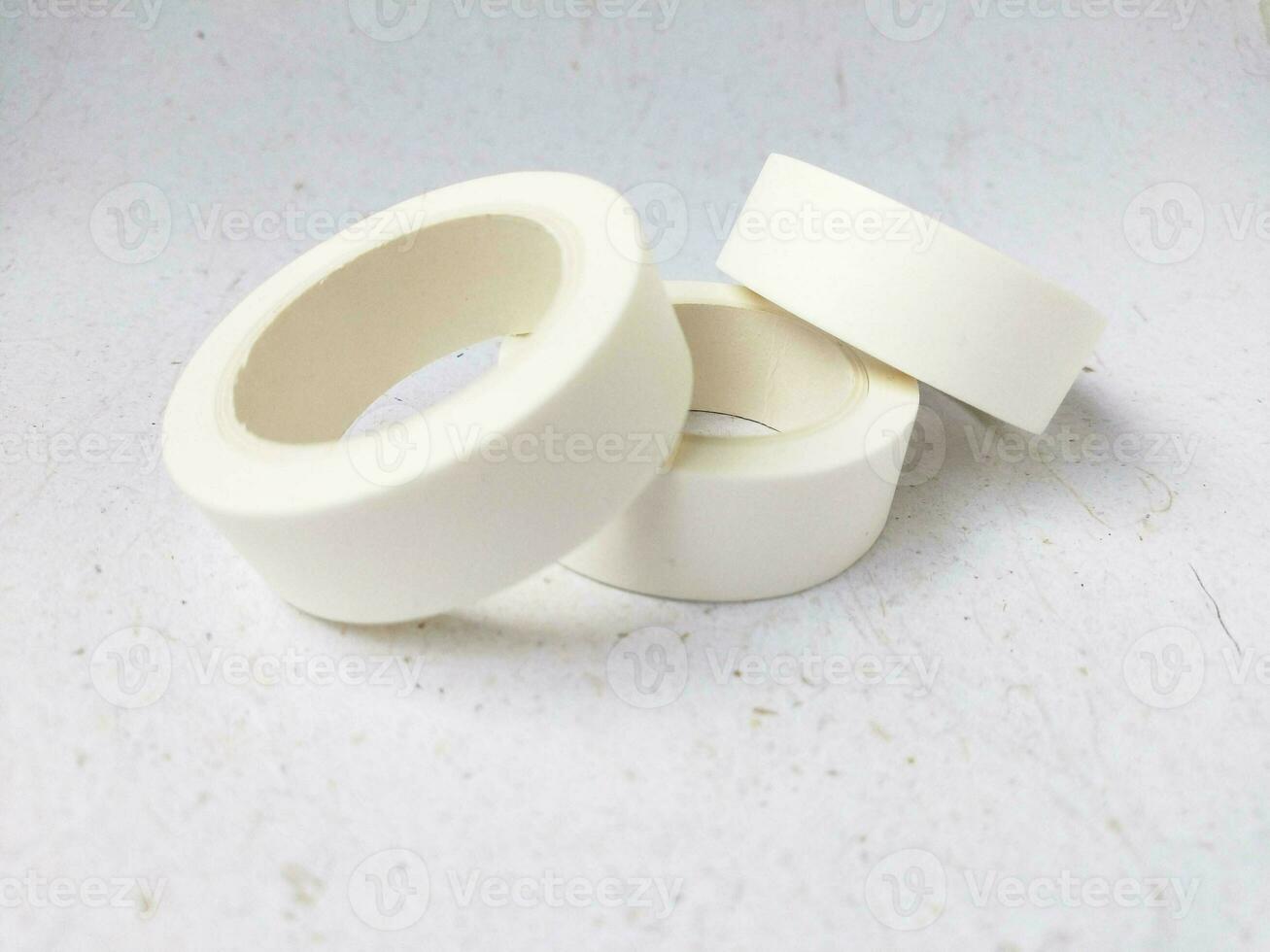 roll of white tape on a white background photo