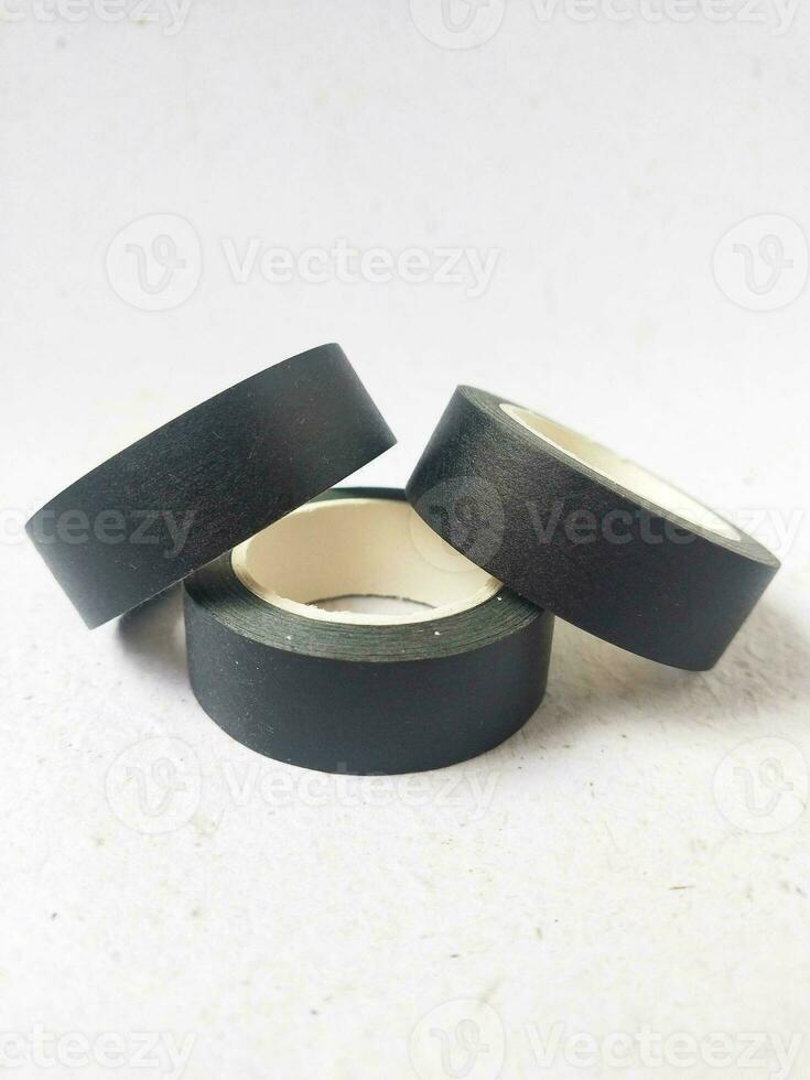 black paper washi tape roll with adhesive tape isolated on white background photo