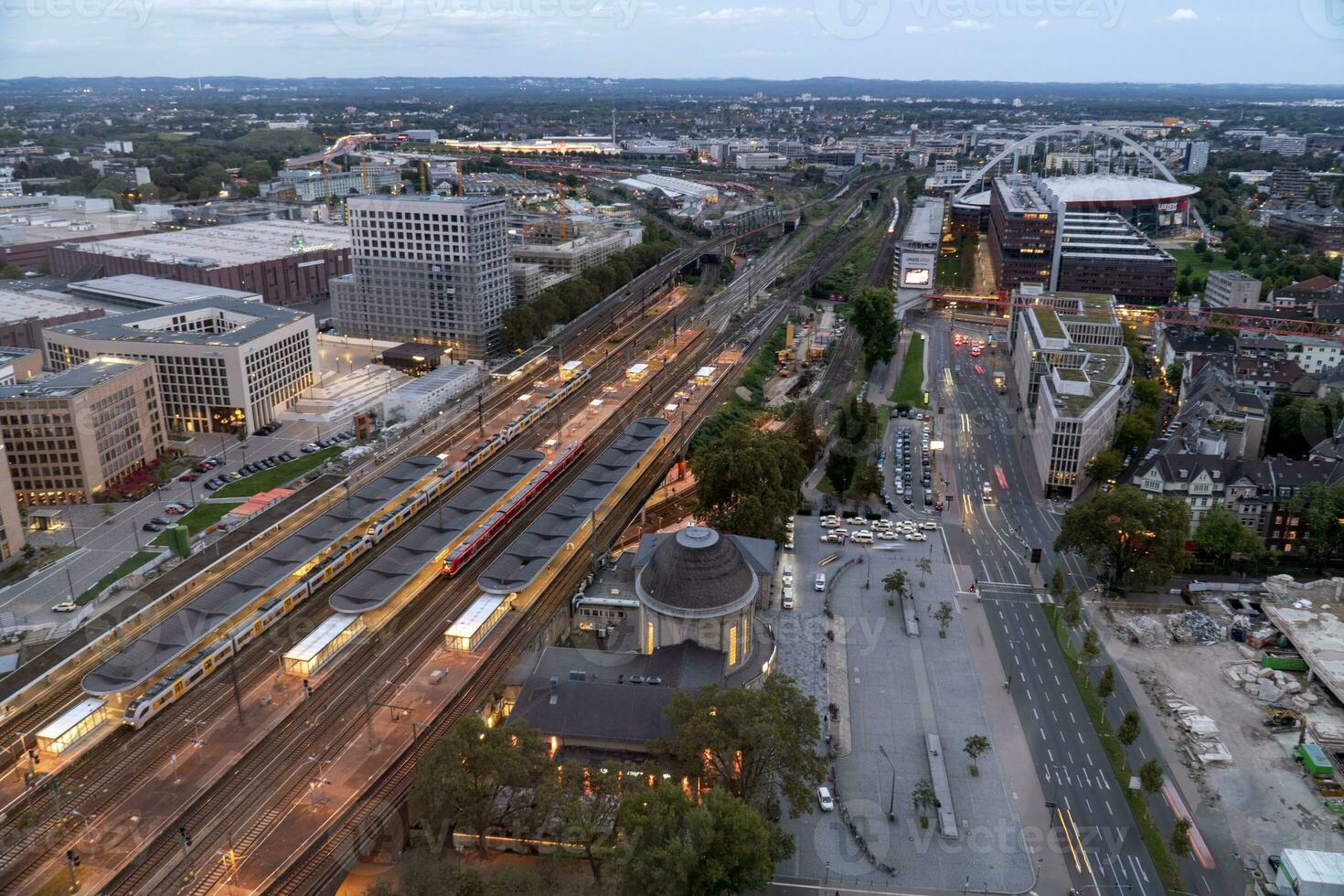 evening aerial view of Cologne station Koln Messe Deutz and illuminated railway tracks, seen from the Cologne Triangle photo