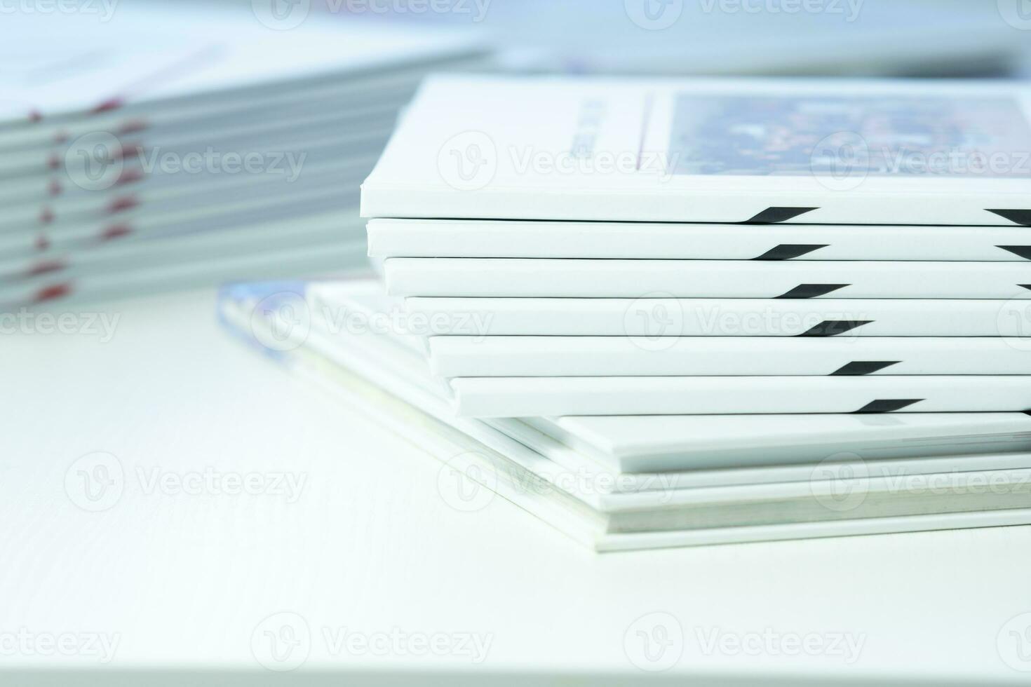 stack of freshly printed photobooks on the table close-up photo