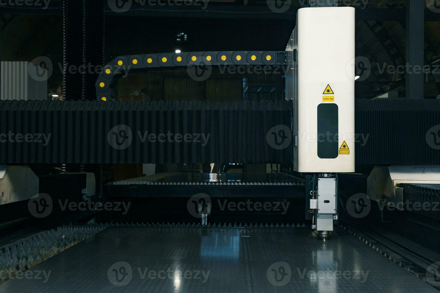 industrial laser cutting machine during metal sheet processing photo