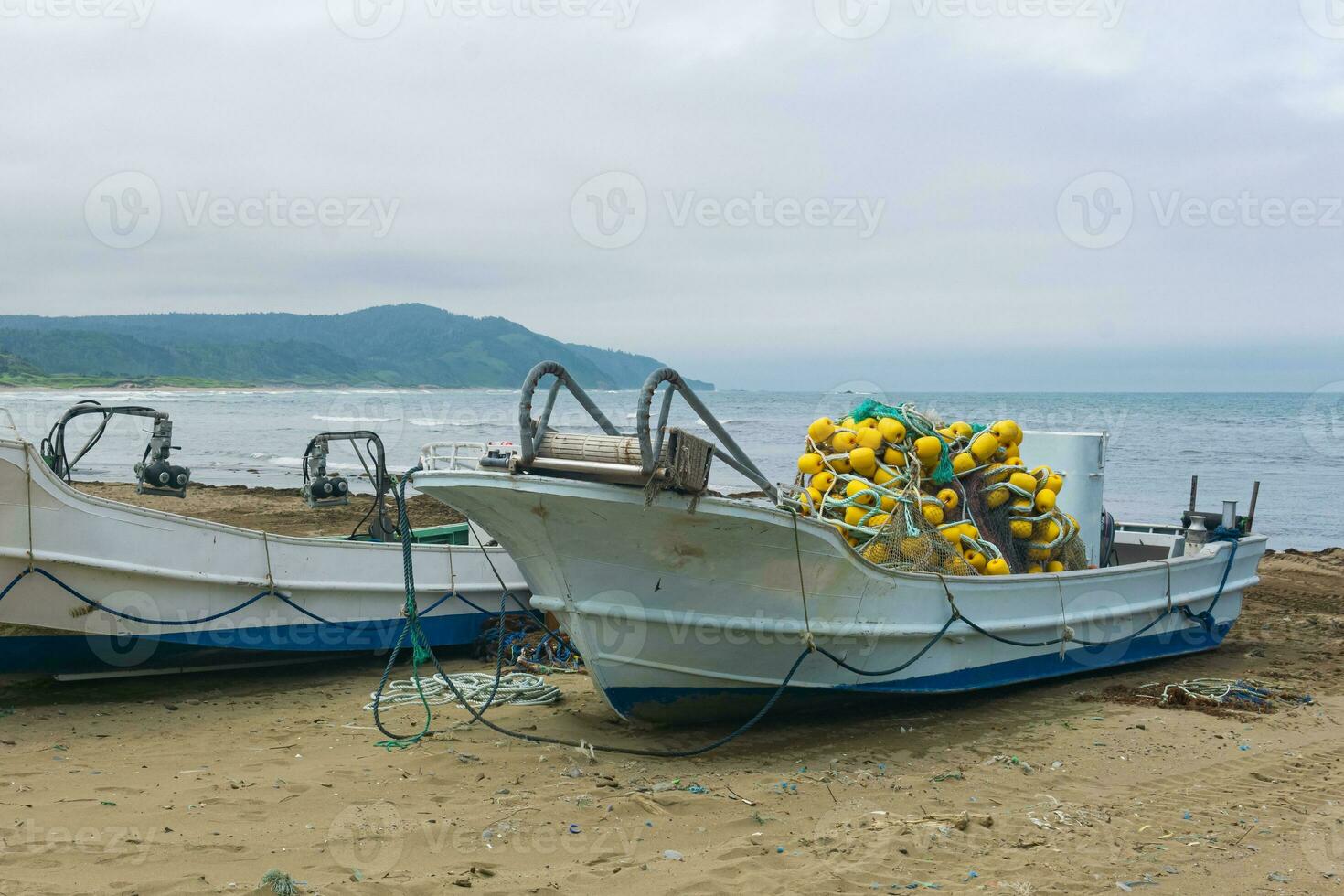 small fishing boats and nets on the seashore 35871027 Stock Photo