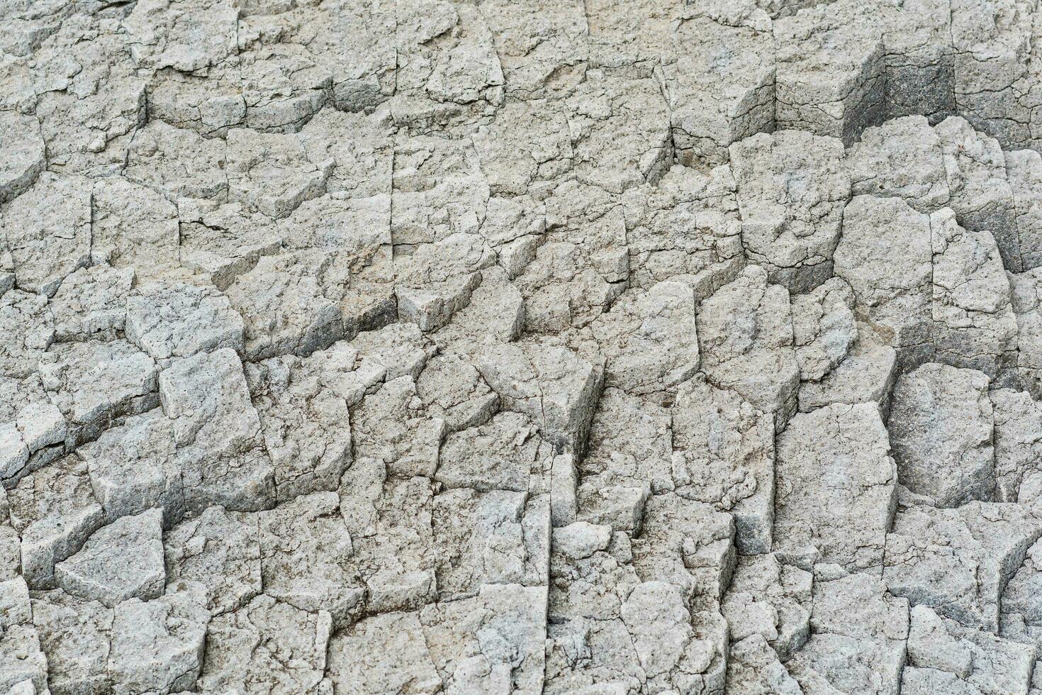 natural stone background, the bases of lava basalt columns form a kind of pavement photo
