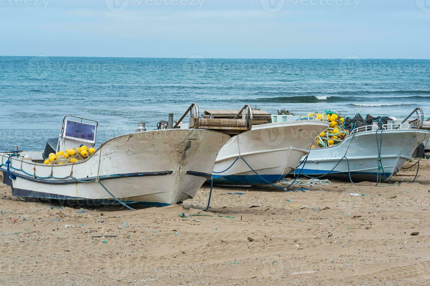 small fishing boats and nets on the seashore 35871027 Stock Photo at  Vecteezy