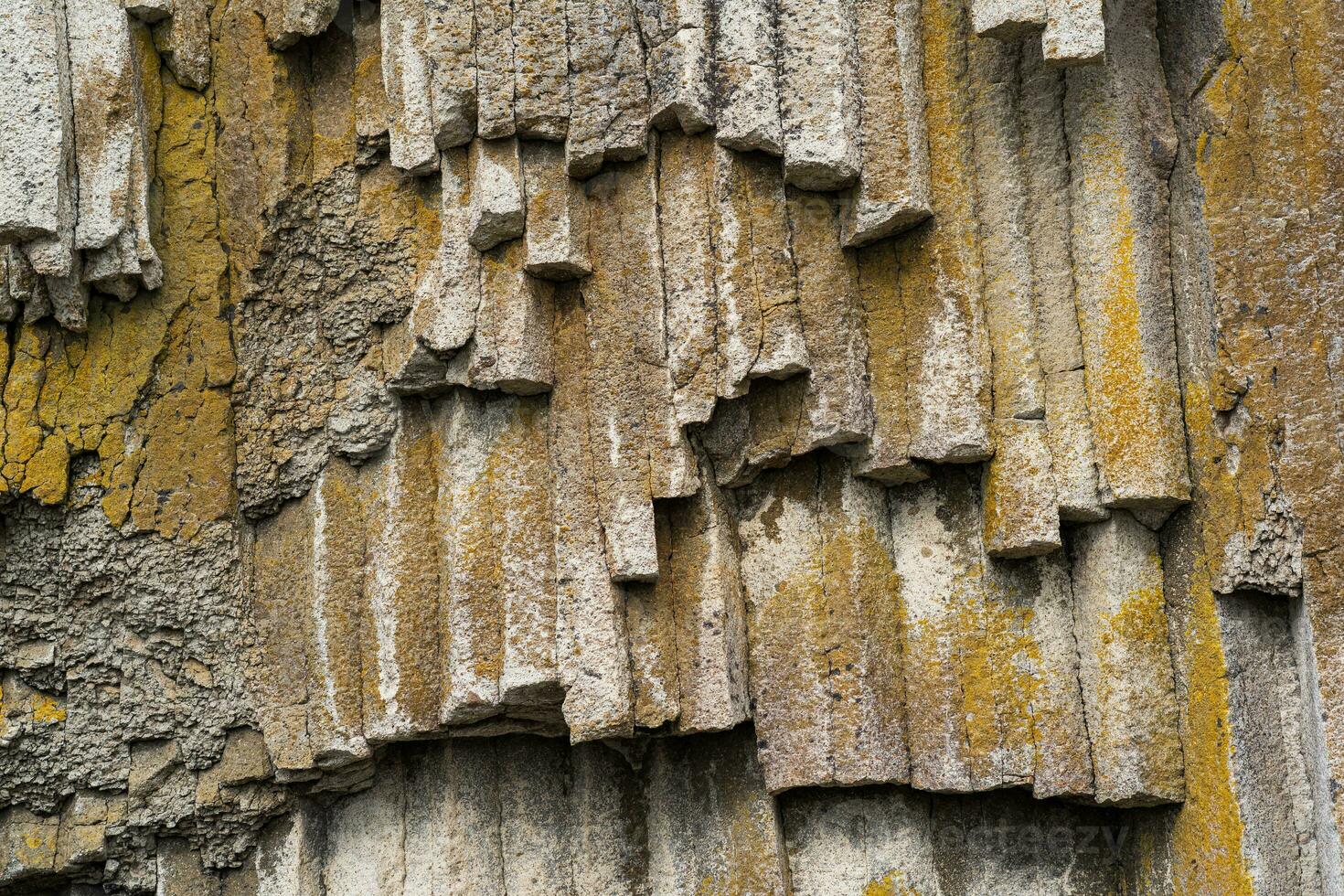 natural background, rock fragment from volcanic lava columns photo