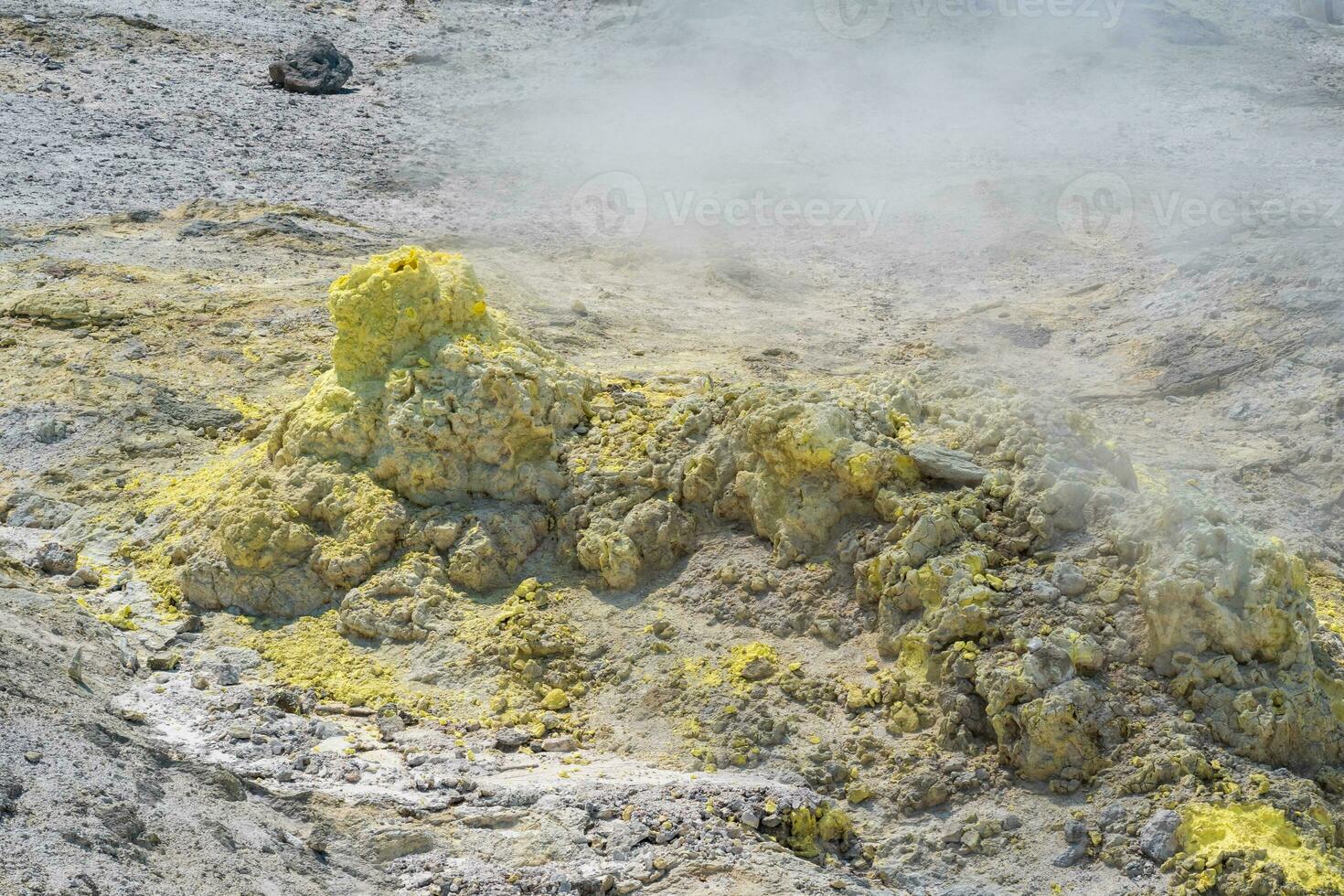 smoking solfatara in a fumarole field on the slope of the Mendeleev volcano photo