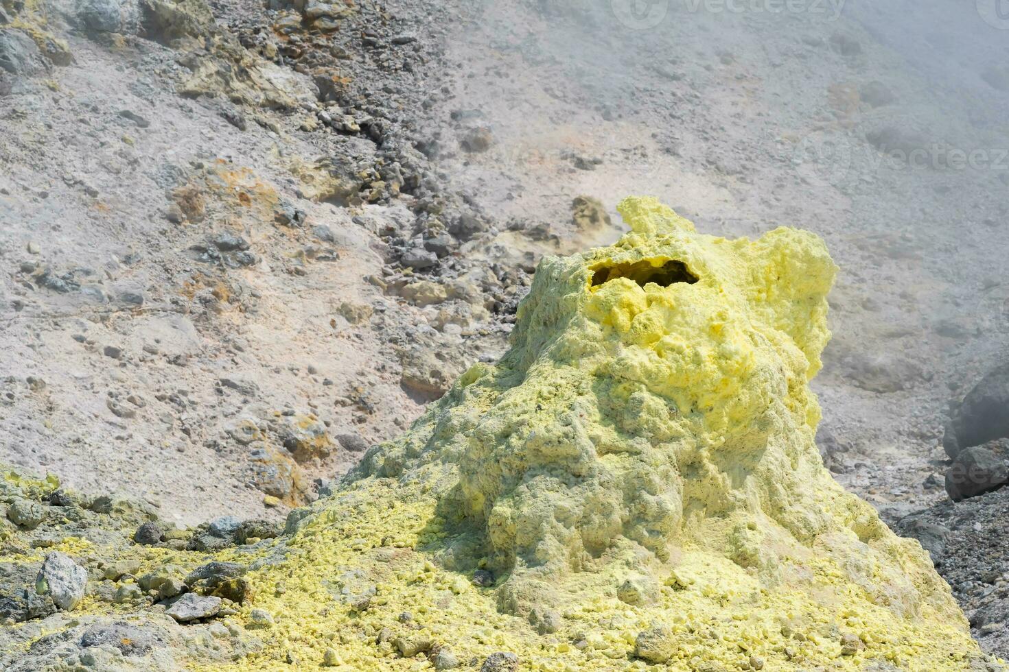 sulfur deposits around a solfatara in a fumarole field of volcano photo