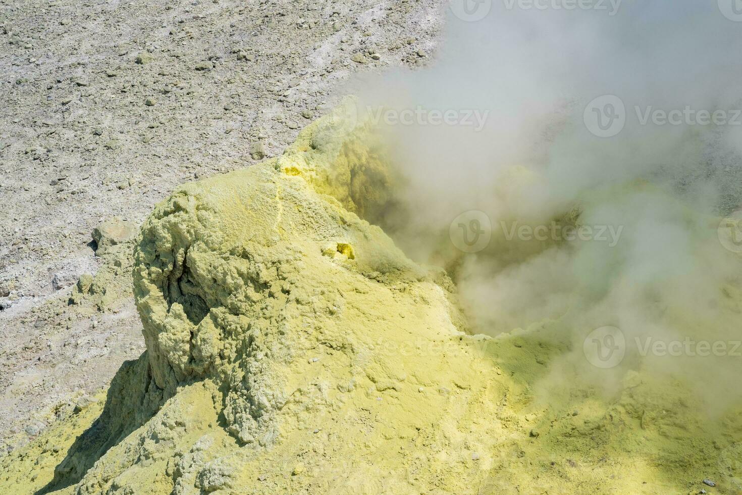 steaminf fumarola in a solfataric field on a slope of the volcano photo