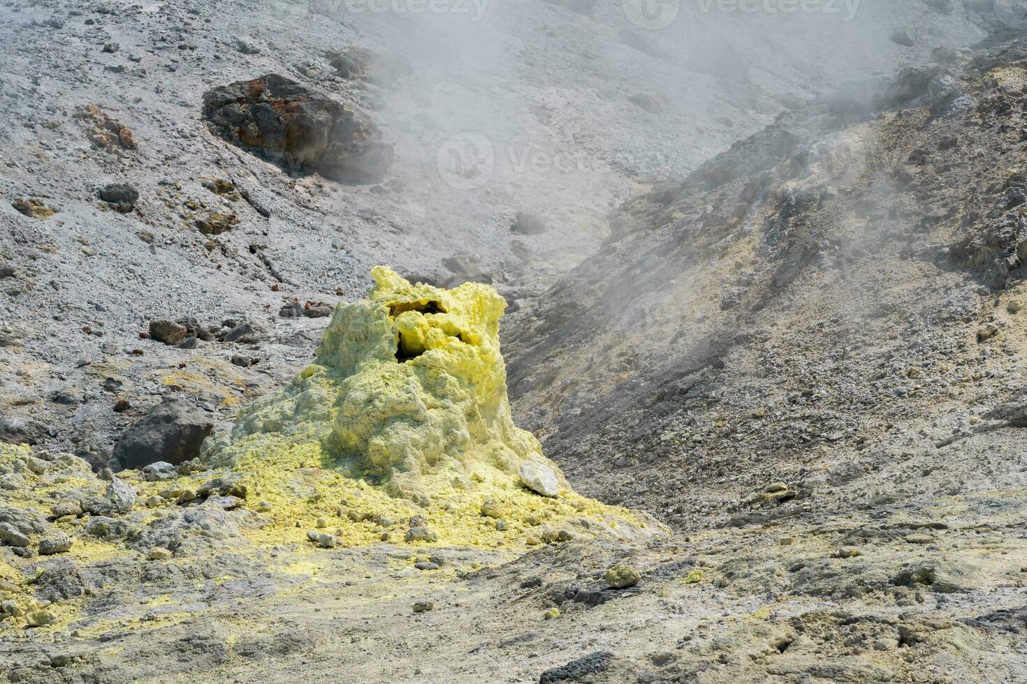 sulfur deposits around a fumarole in a solfataric field photo