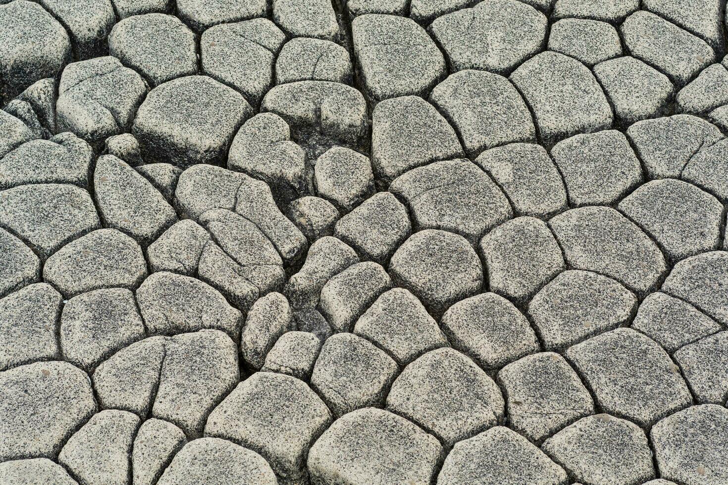 natural stone background, the remains of lava basalt columns form a kind of cobblestone causeway photo