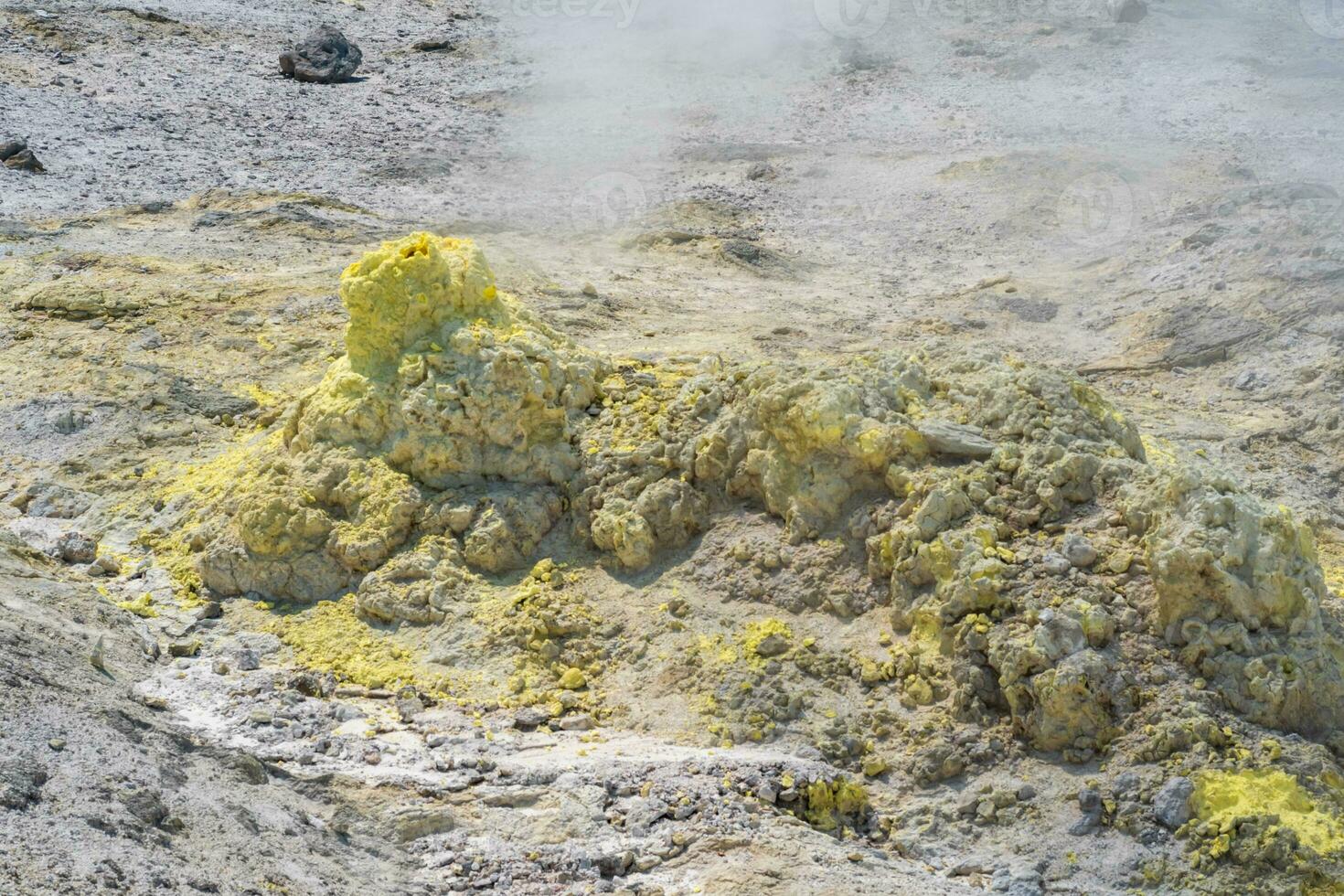 deposits of native sulfur in a fumarole field on the slopes of the Mendeleev volcano photo