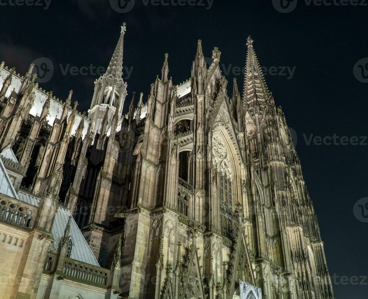 Exterior of Cologne Cathedral at night photo