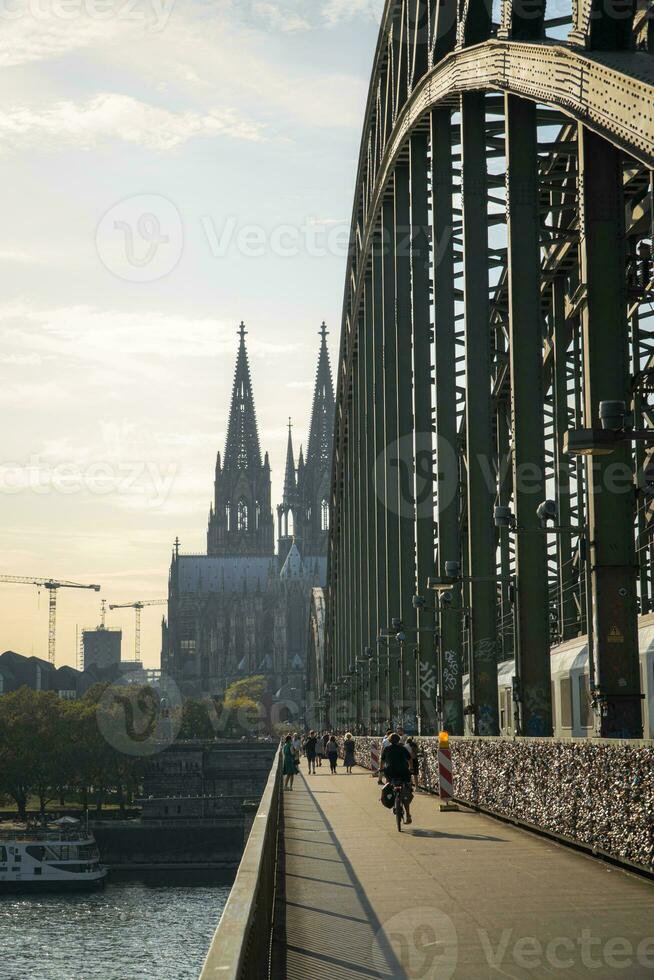 Hohenzollern Bridge and Cologne Cathedral in the evening photo