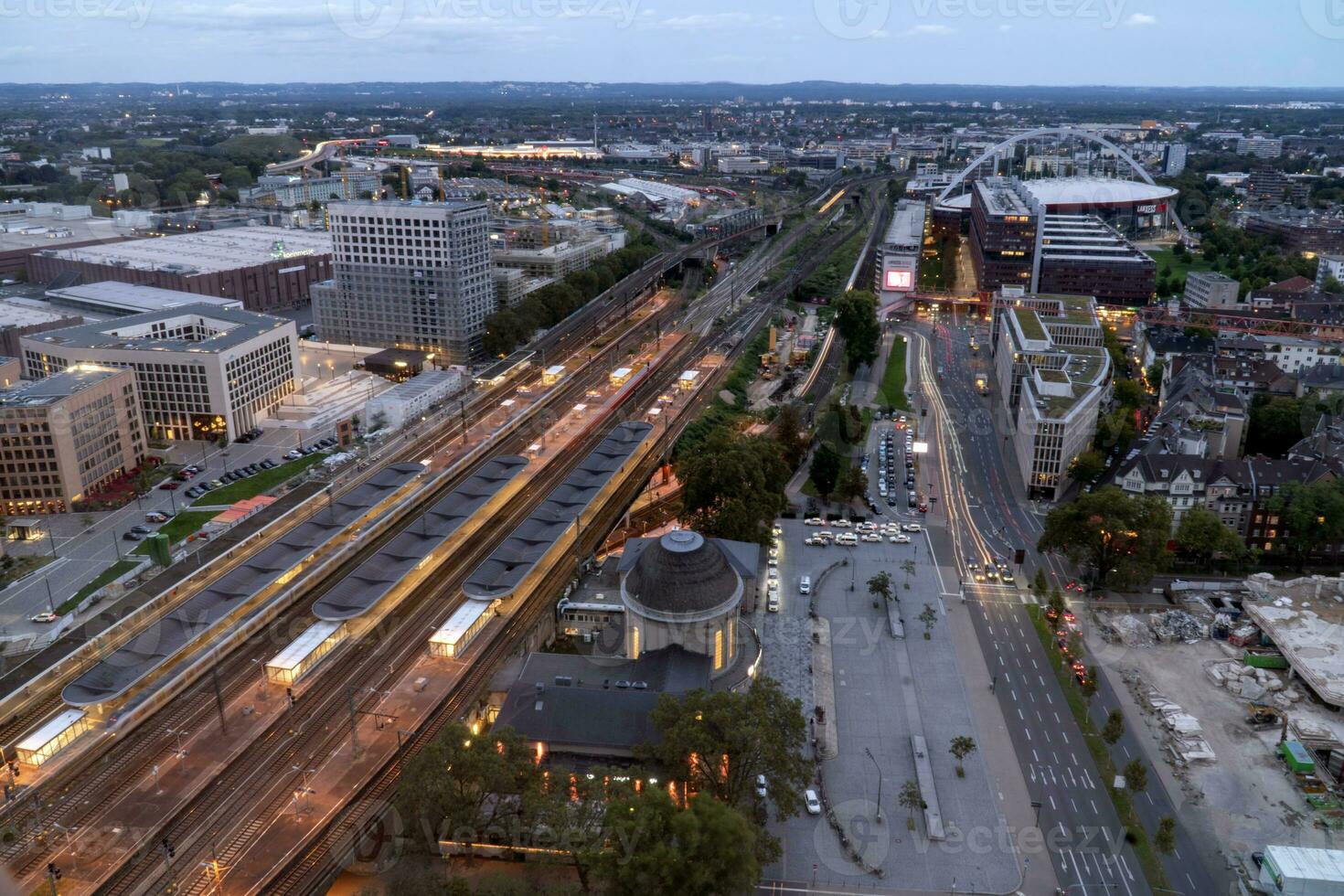 evening aerial view of Cologne station Koln Messe Deutz and illuminated railway tracks, seen from the Cologne Triangle photo