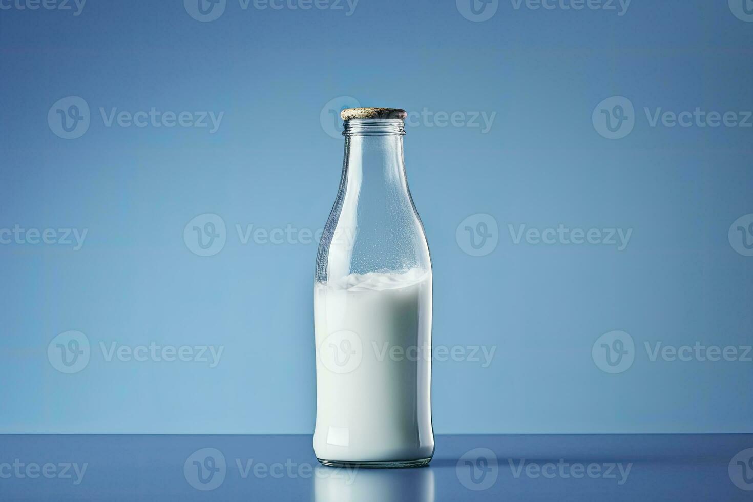 AI generated A glass bottle with full milk on blue background. AI Generated photo