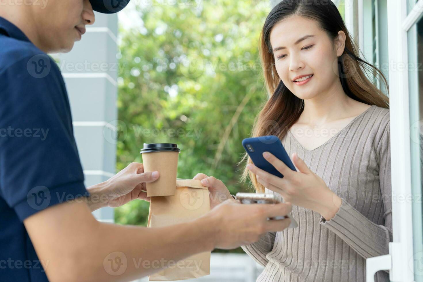 Happy smile Asian woman scan QR code for pay of food. Delivery man send deliver express. online shop, paper container, takeaway, postman, delivery service, packages, electronic money, Digital transfer photo