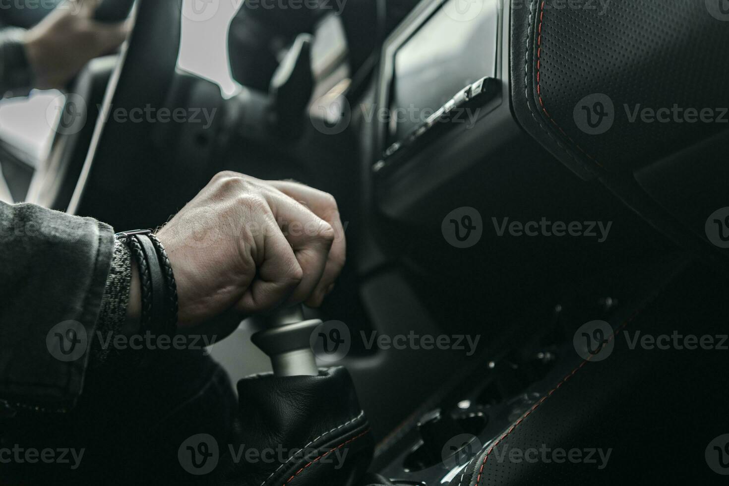 Caucasian Driver Driving Stick Shift Manual Transmission Car photo