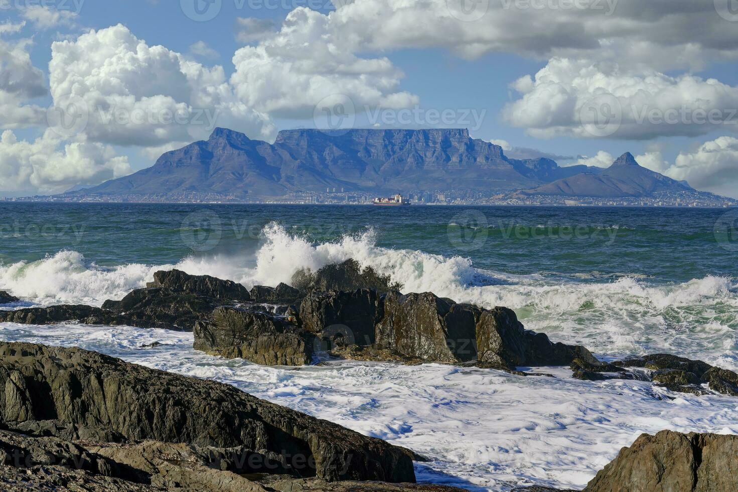 View of Table Mountain from Blue Mountain Beach, Cape Town, South Africa photo