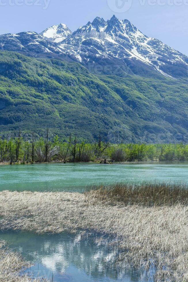 Castillo mountain range and Ibanez river wide valley viewed from the Pan-American Highway, Aysen Region, Patagonia, Chile photo