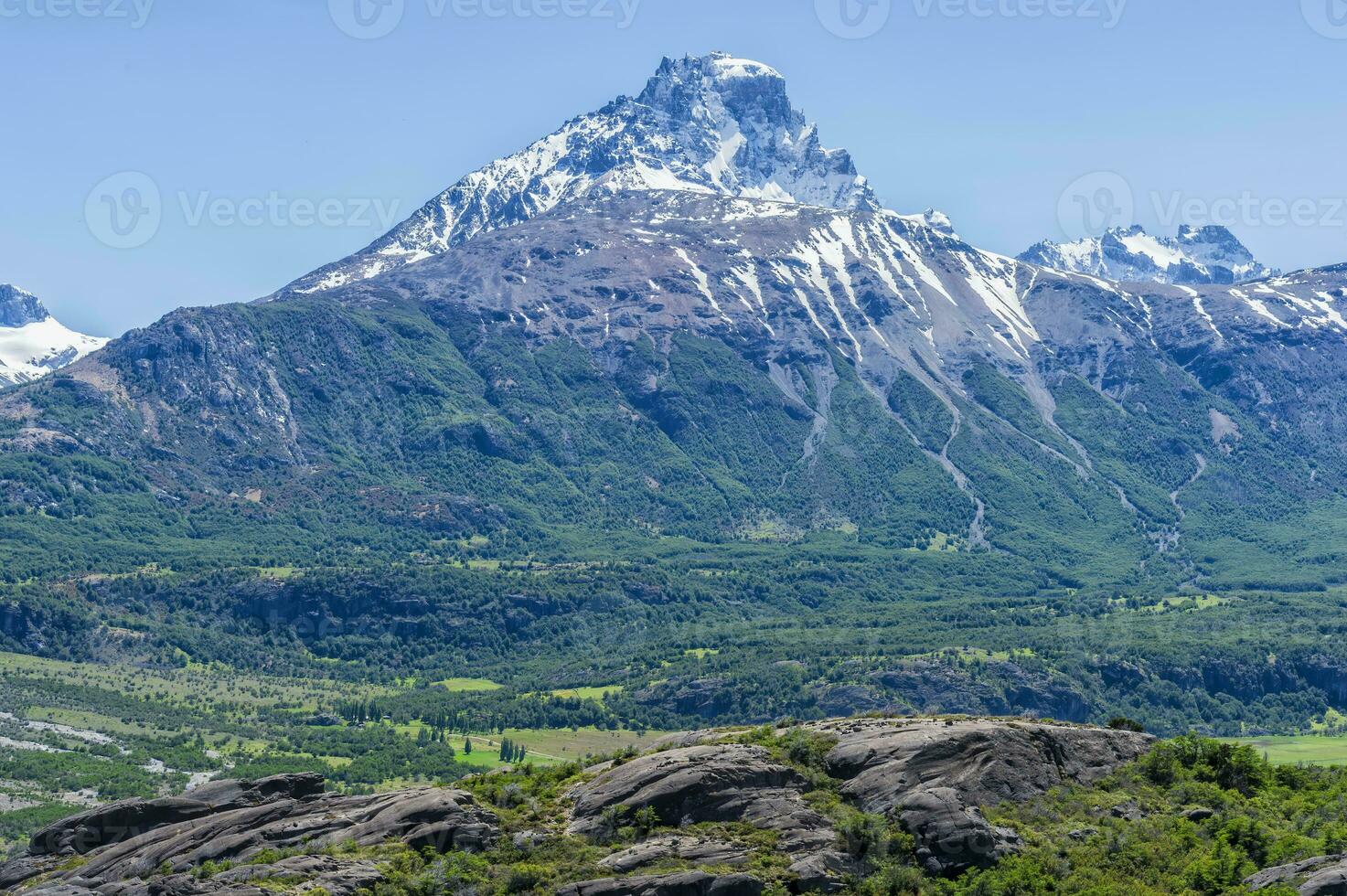 Castillo mountain range and Ibanez river wide valley viewed from the Pan-American Highway, Aysen Region, Patagonia, Chile photo