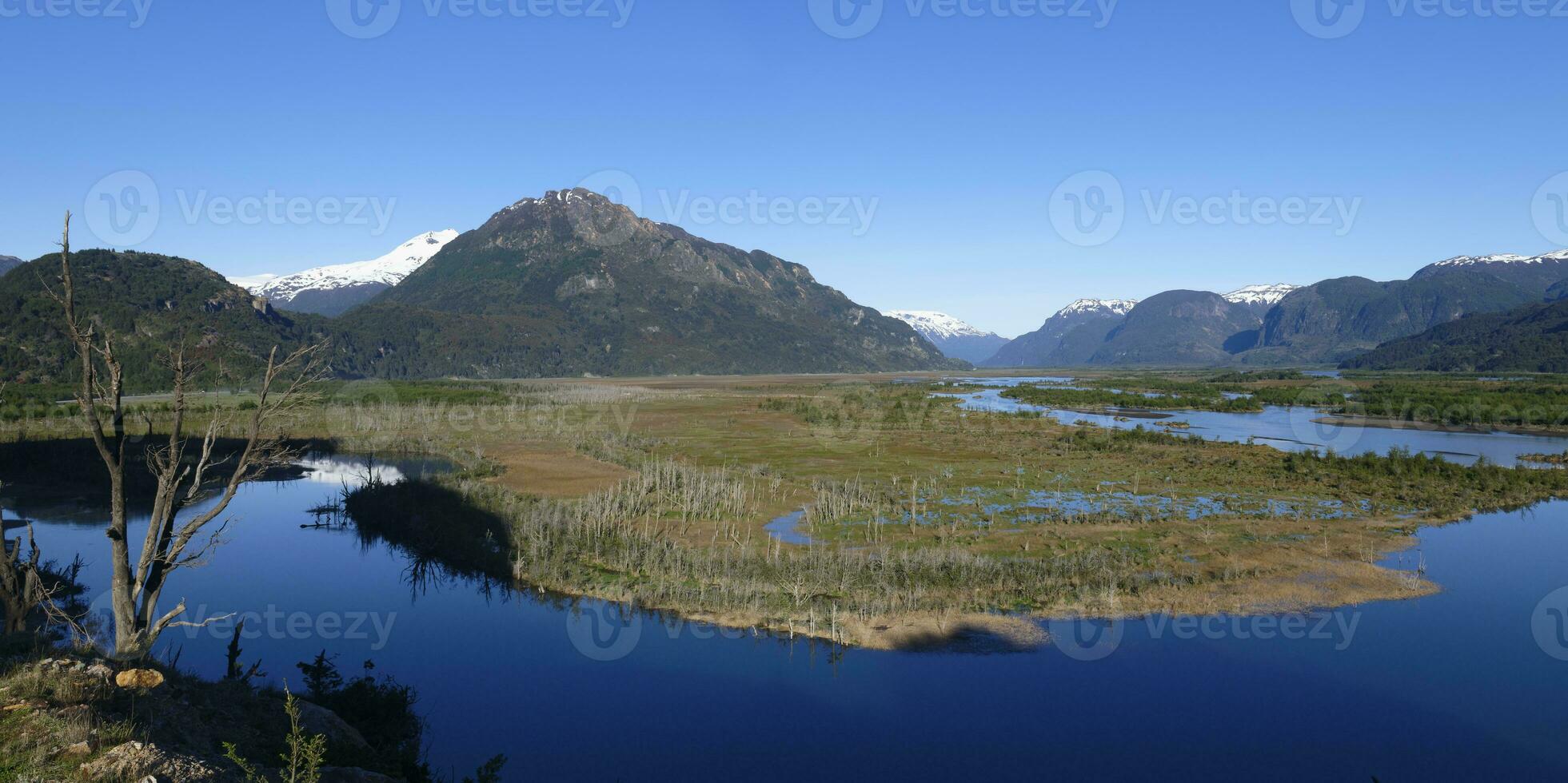 Castillo mountain range and Ibanez river wide valley viewed from the Pan-American Highway, Aysen Region, Patagonia, Chile photo