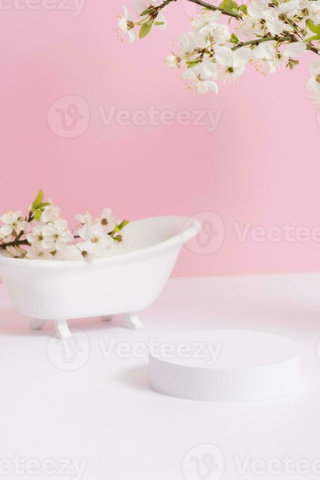 Empty podium or pedestal with spring bloom. Mock up for cosmetic products photo