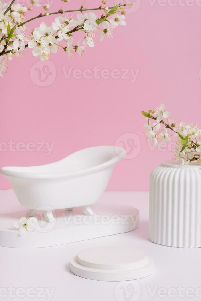 Empty podium or pedestal with spring bloom. Mock up for cosmetic products photo
