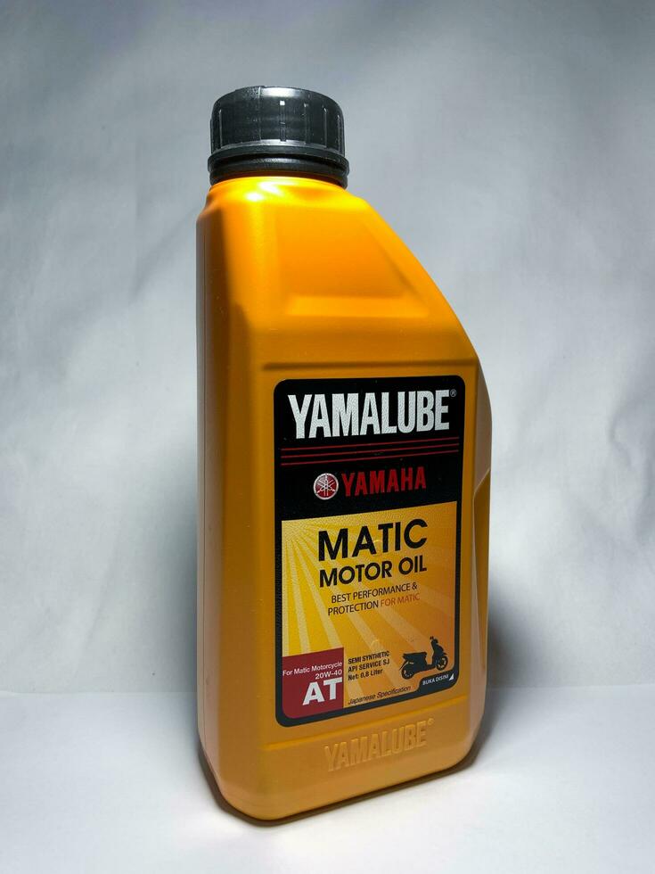 Surakarta, Indonesia, 2023 - Yamalube matic motor oil, semi synthetic api service sj for matic motorcycle 800ml. Yamaha. Yamalube oil yellow packaged. photo