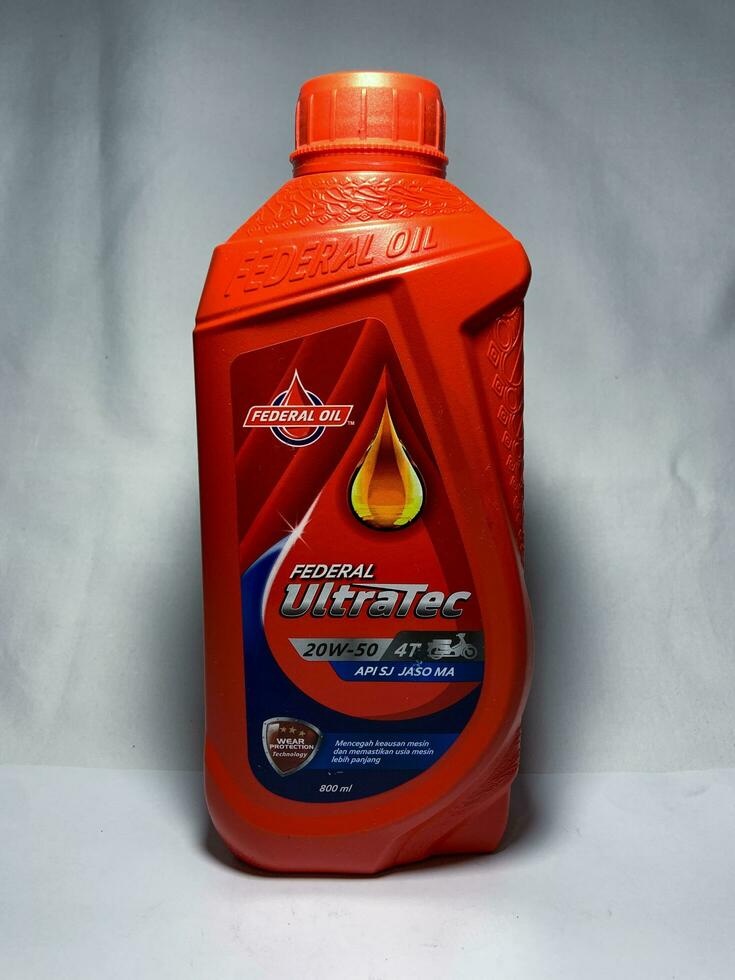 Surakarta, Indonesia, 2023 Federal Ultratec motor oil for 4T, wear protection technology API SJ JASO MA 800ml. Federal Oil. Plastic bottle for engine oil. photo