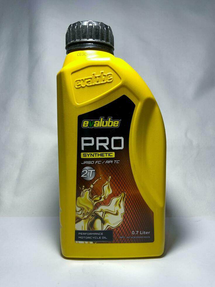 Surakarta, Indonesia, 2023 - Evalube Pro 2T motor oil, synthetic jaso for 2T motorcycle 700ml. Plastic bottle for engine oil. photo