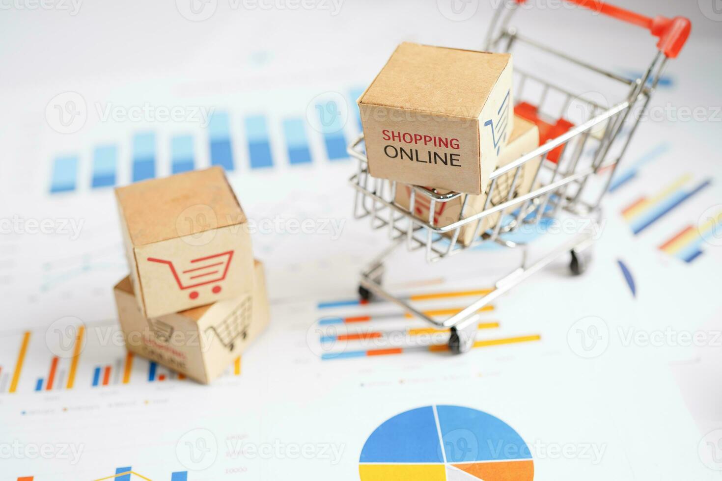 Online shopping, Shopping cart box on business graph, import export, finance commerce. photo