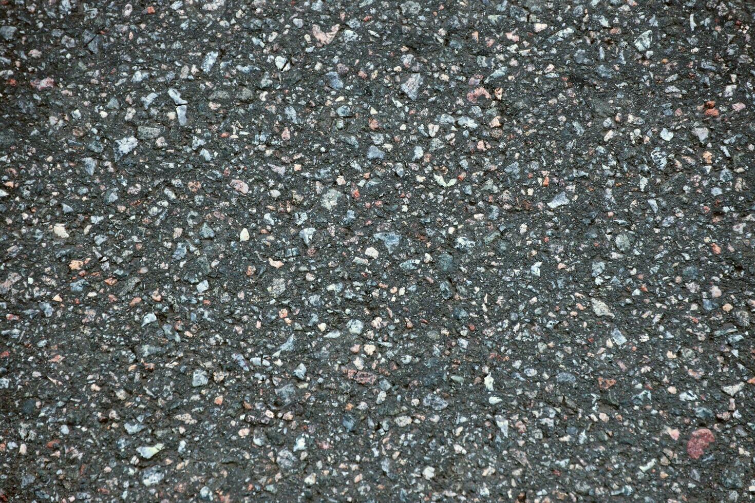 Surface grunge rough of asphalt. Tarmac dark grey grainy road. Texture Background Top view photo