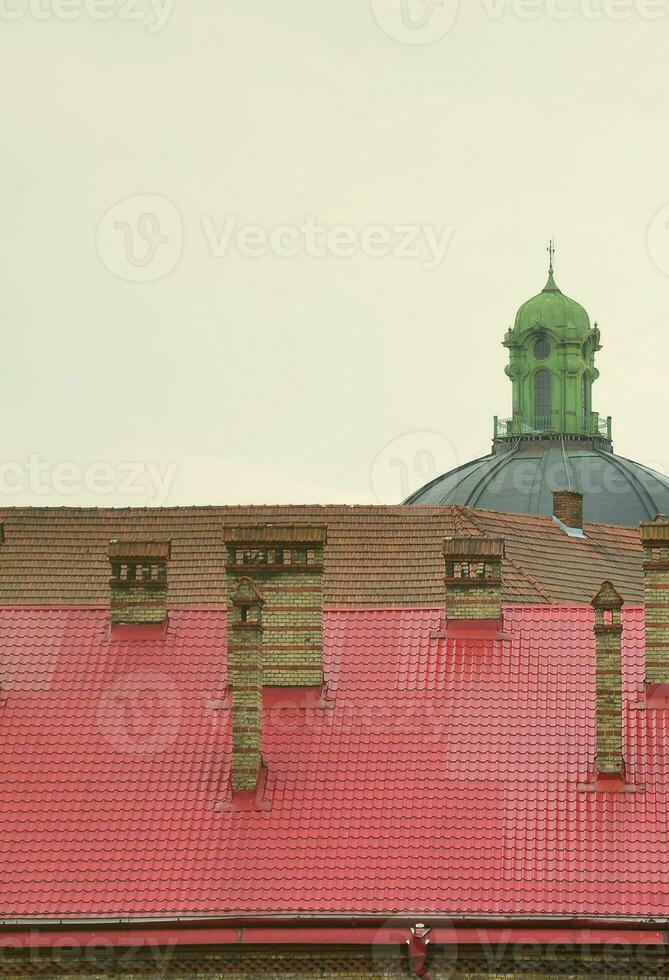 Fragment of a metal roof of the restored old multi-storey building in Lviv, Ukraine photo