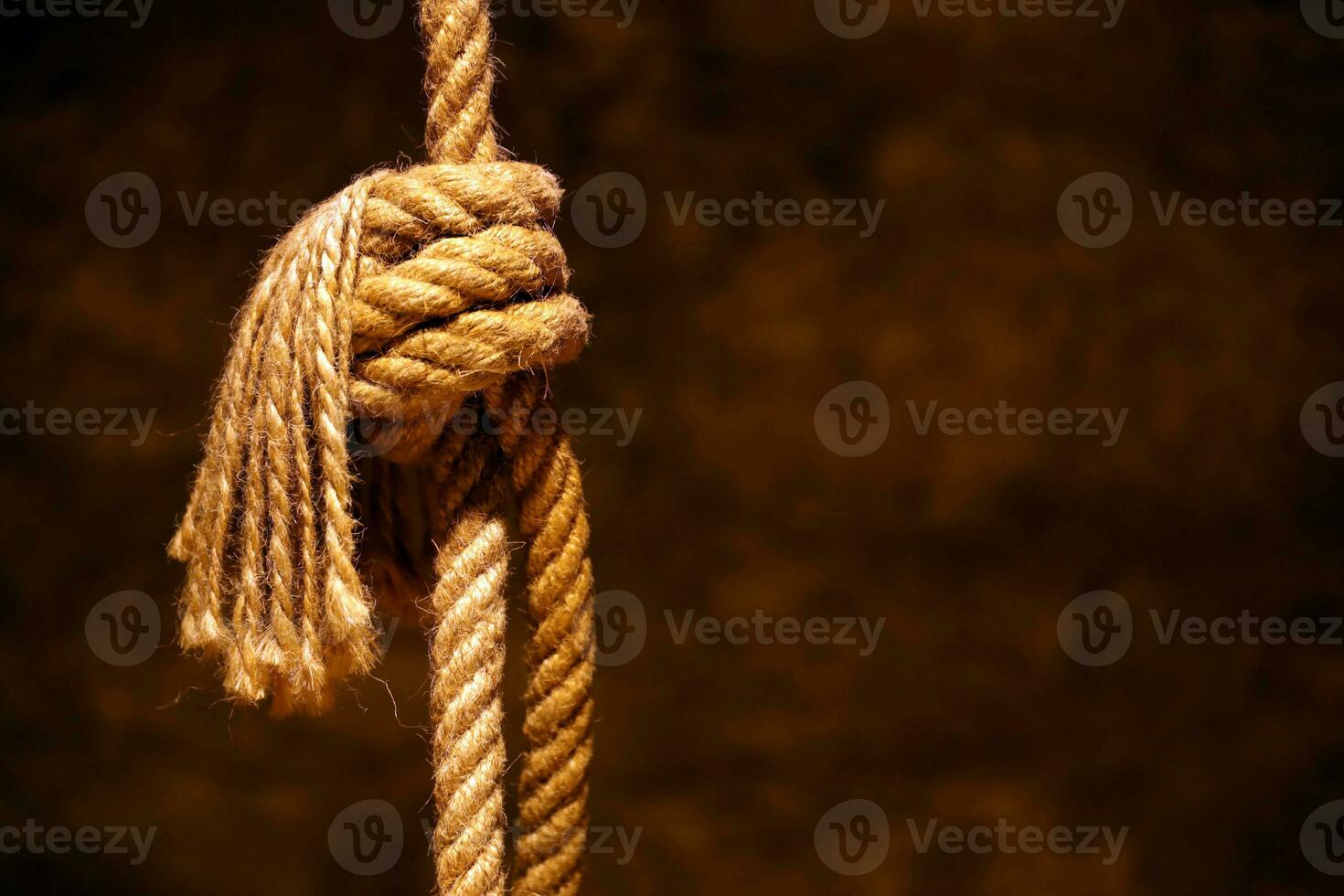 Noose in prison of old castle cellar and grunge stone wall photo