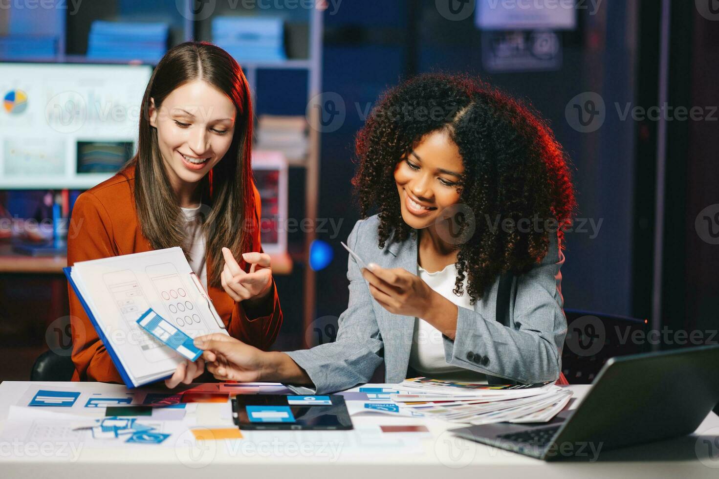 UX developer and ui designer brainstorming about mobile app interface wireframe design with customer breif and color code photo
